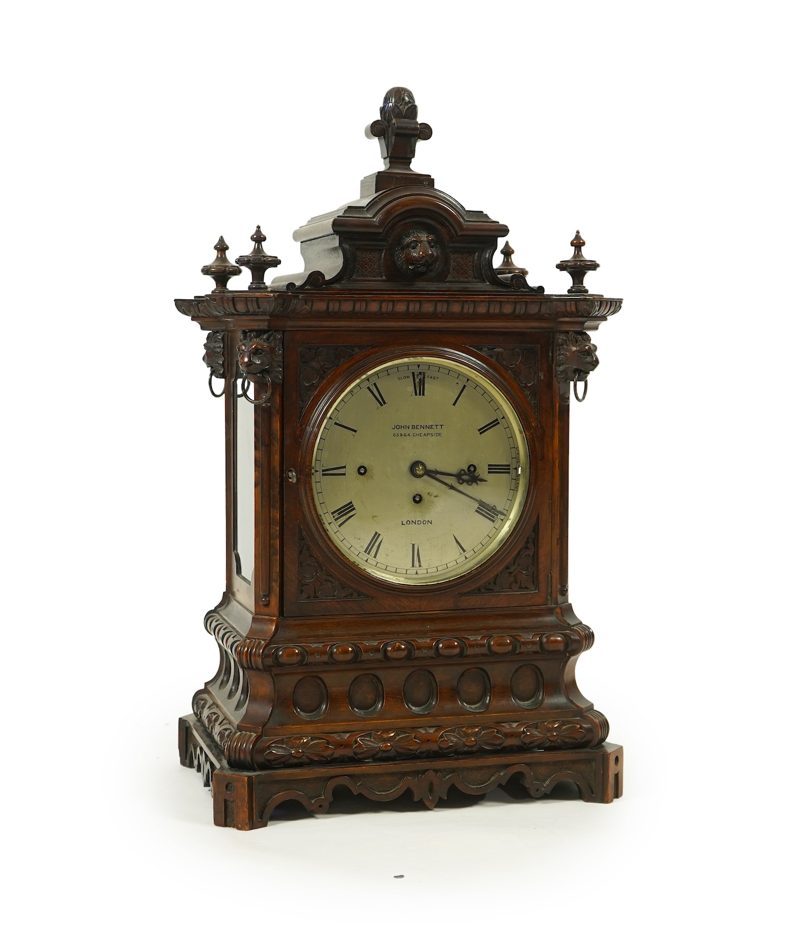 A late 19th century carved oak triple fusee bracket clock